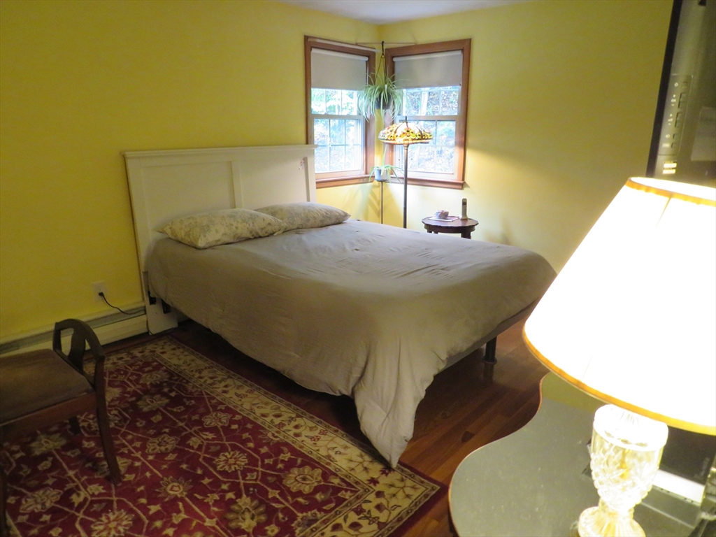 8 Talbot Road Canton, MA 02021 - Photo 18 of 41 a bedroom with a bed dresser and a window