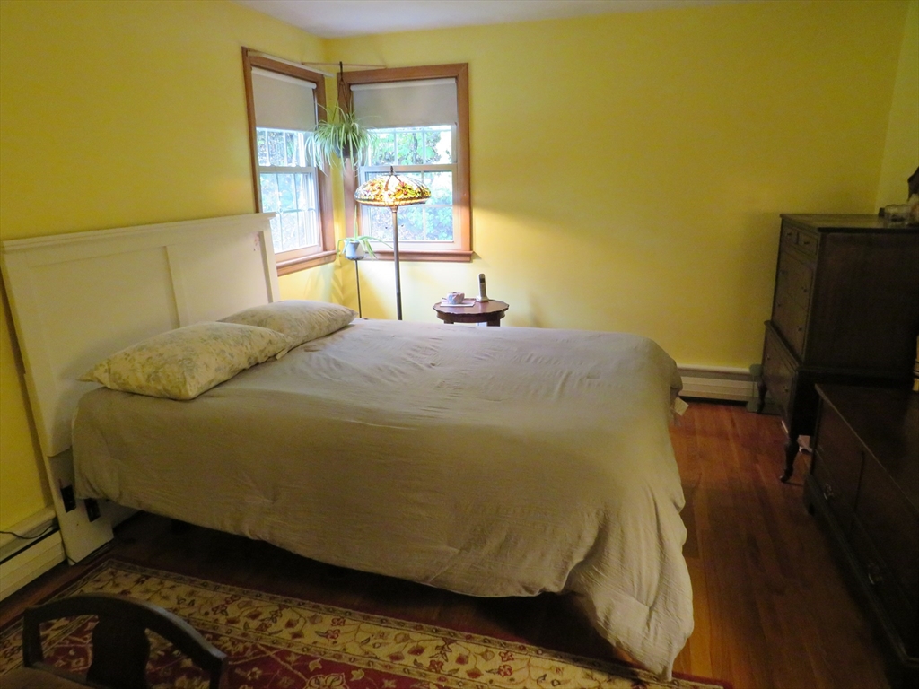 8 Talbot Road Canton, MA 02021 - Photo 19 of 41 a bedroom with a bed and wooden floor