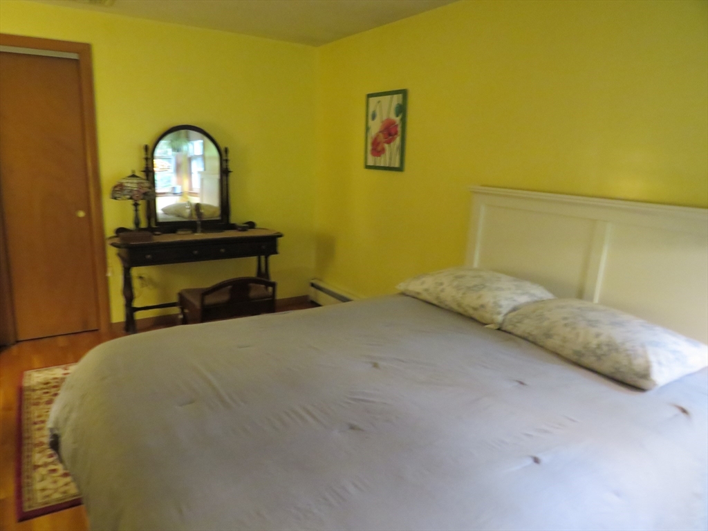 8 Talbot Road Canton, MA 02021 - Photo 20 of 41 a bedroom with a bed and a dresser