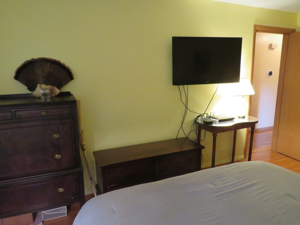 8 Talbot Road Canton, MA 02021 - Photo 21 of 41 a bedroom with a bed and mirror