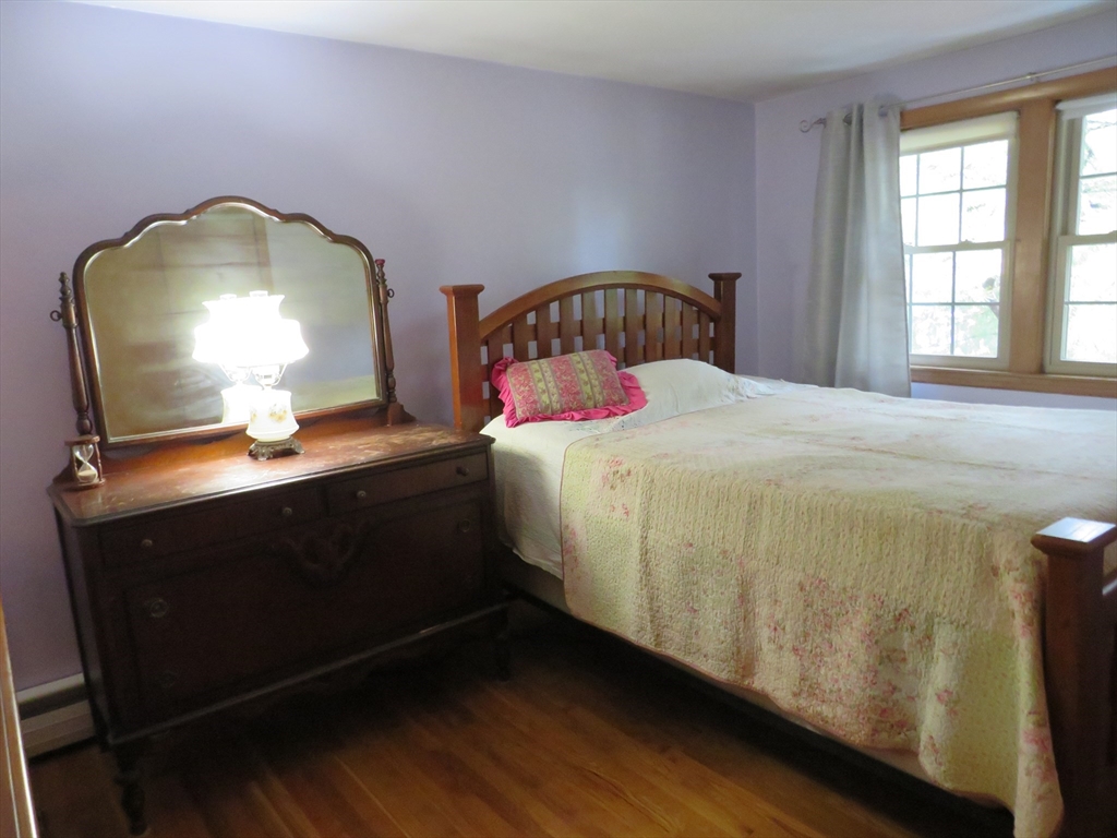 8 Talbot Road Canton, MA 02021 - Photo 22 of 41 a bedroom with a bed and a mirror
