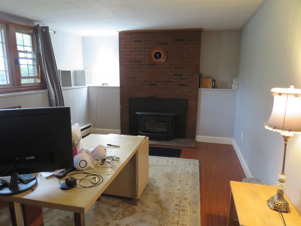 8 Talbot Road Canton, MA 02021 - Photo 25 of 41 a living room with furniture and a fireplace