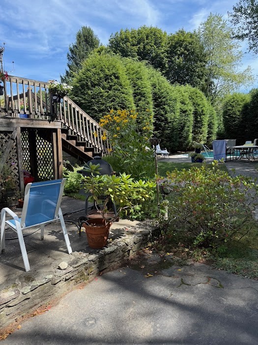 8 Talbot Road Canton, MA 02021 - Photo 40 of 41 a view of a chairs and table in the backyard