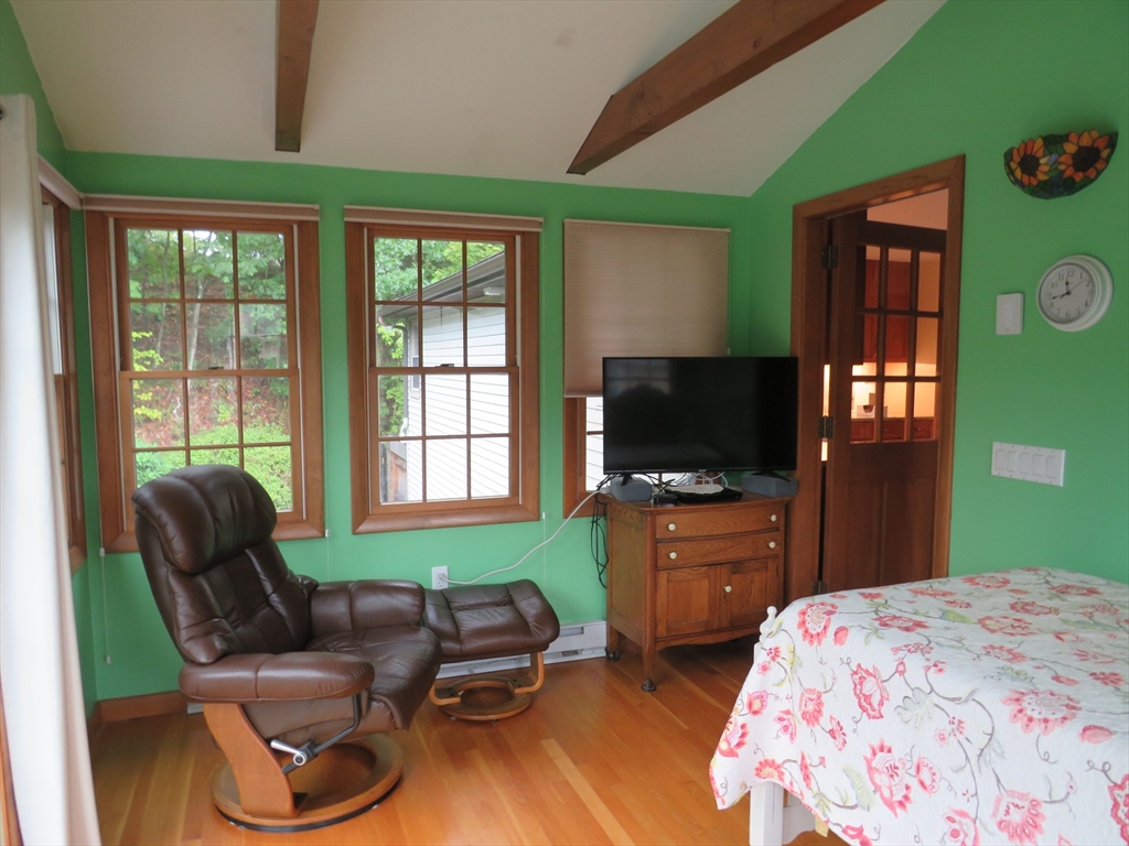8 Talbot Road Canton, MA 02021 - Photo 8 of 41 a bedroom with furniture and a flat screen tv