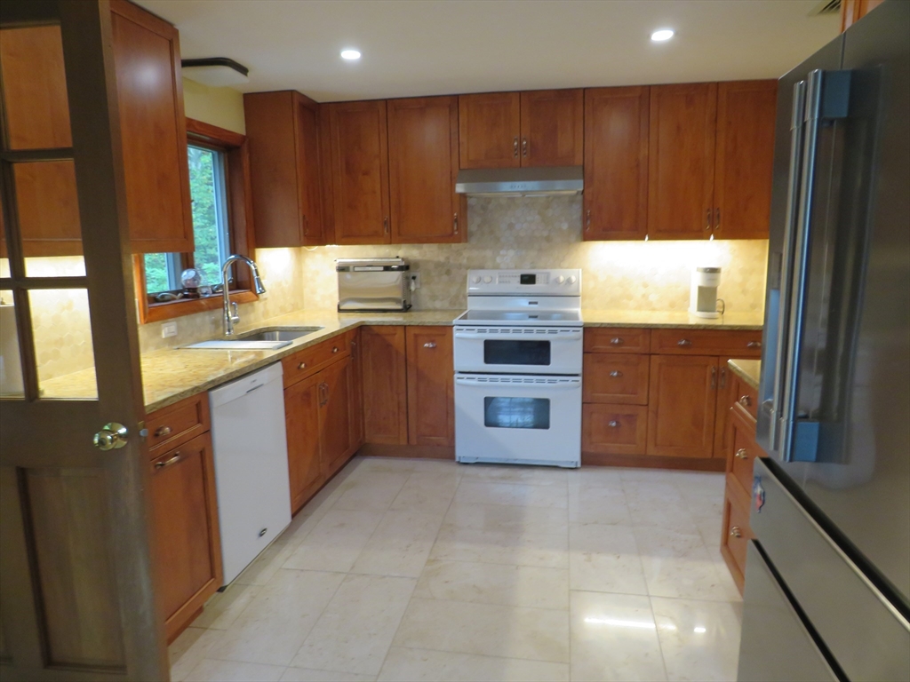 8 Talbot Road Canton, MA 02021 - Photo 10 of 41 a kitchen with stainless steel appliances granite countertop a stove a sink and a refrigerator