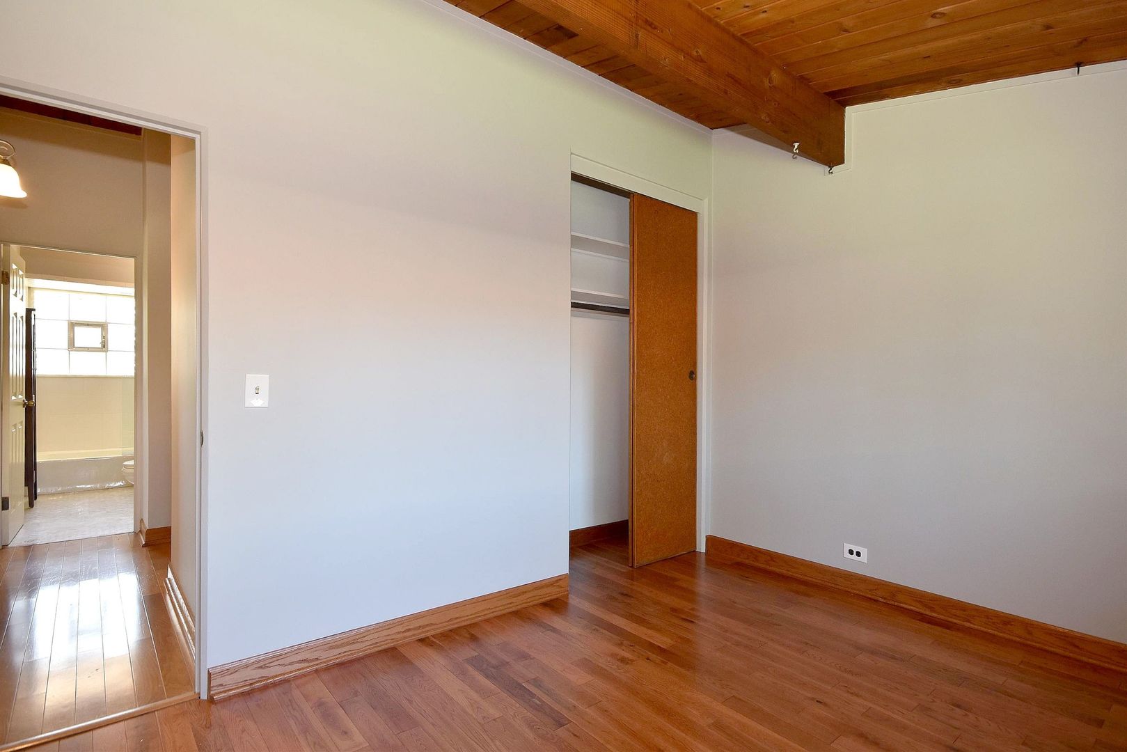 133 Highview Avenue Addison, IL 60101 - Photo 22 of 35 a view of an empty room with wooden floor and a window