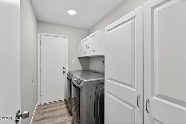 a utility room with a sink dryer and washer
