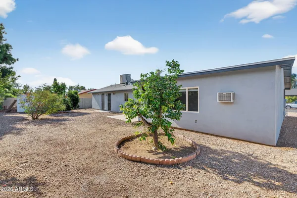 a view of a house with a yard and garage
