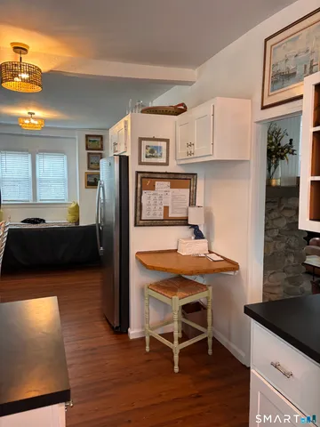 a living room with furniture and a lamp