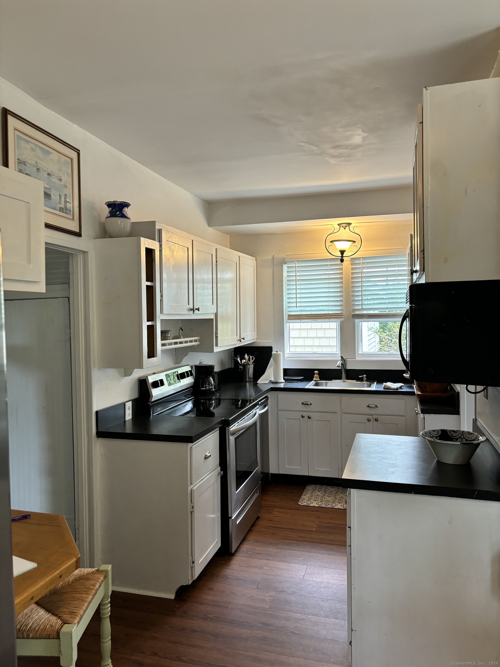 11 Uncas Road East Lyme, CT 06357 - Photo 17 of 28 a kitchen with stainless steel appliances granite countertop a sink stove and refrigerator