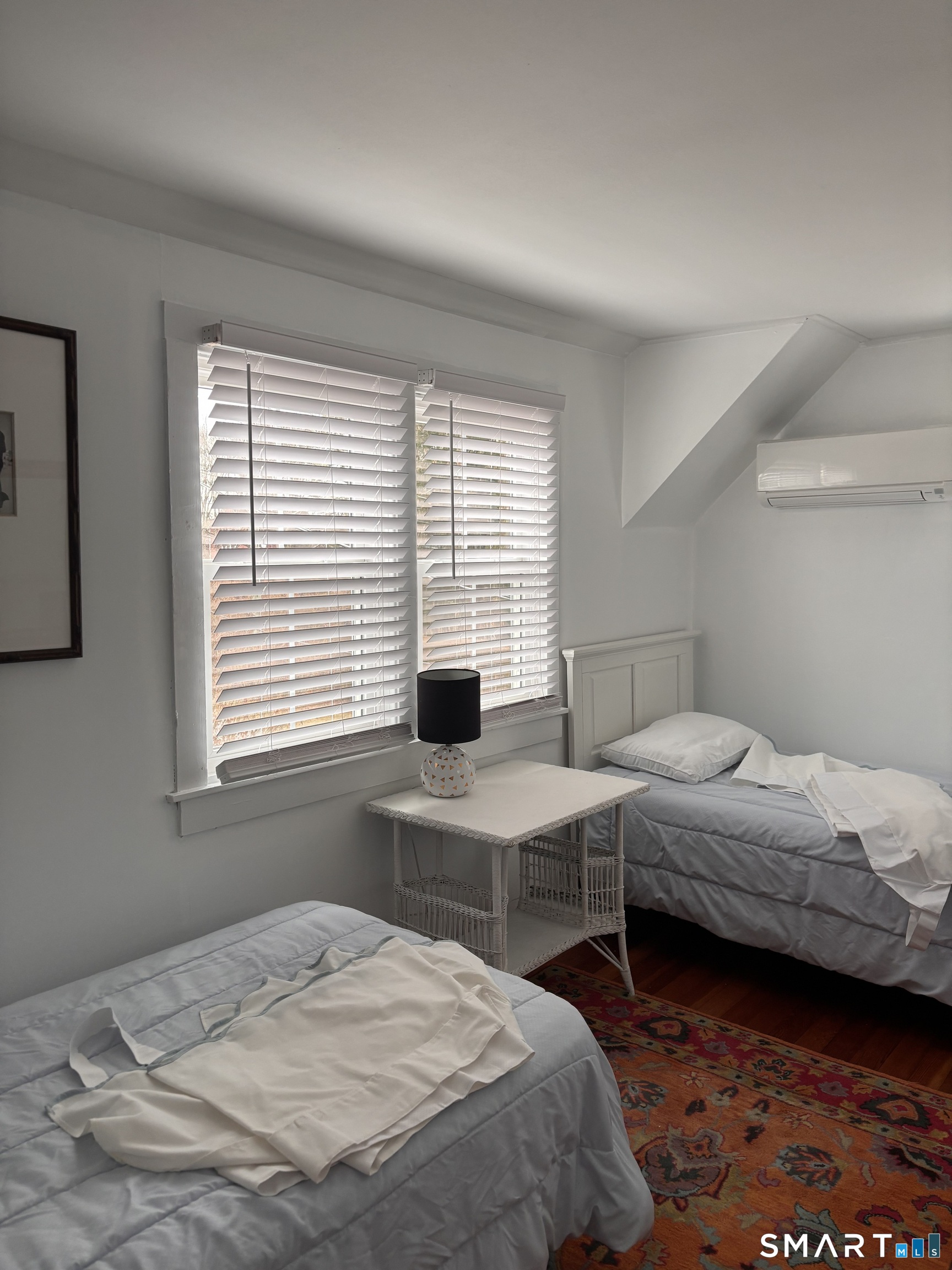 11 Uncas Road East Lyme, CT 06357 - Photo 21 of 28 a bedroom with two beds and a window