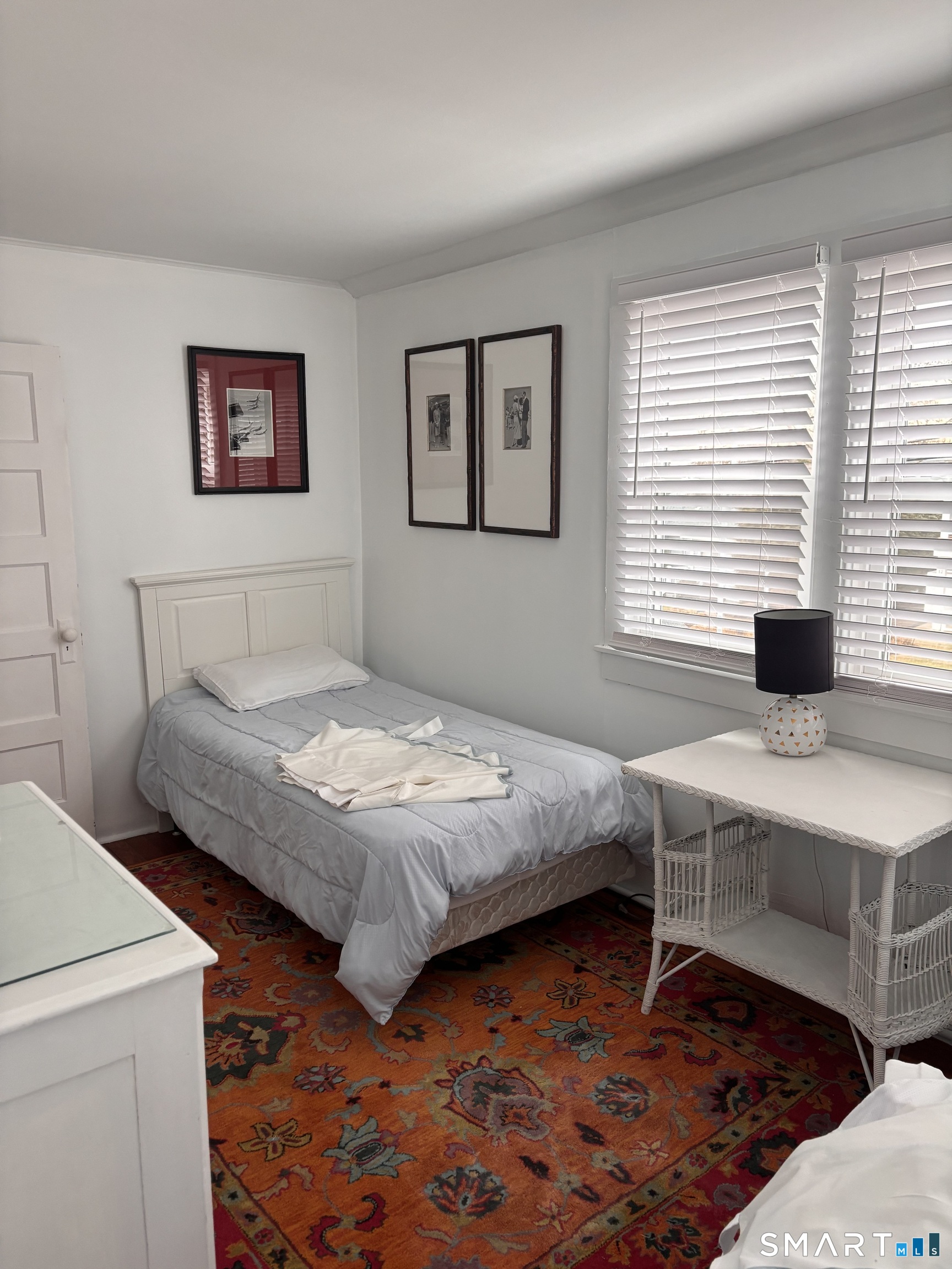 11 Uncas Road East Lyme, CT 06357 - Photo 22 of 28 a bedroom with a bed and a desk