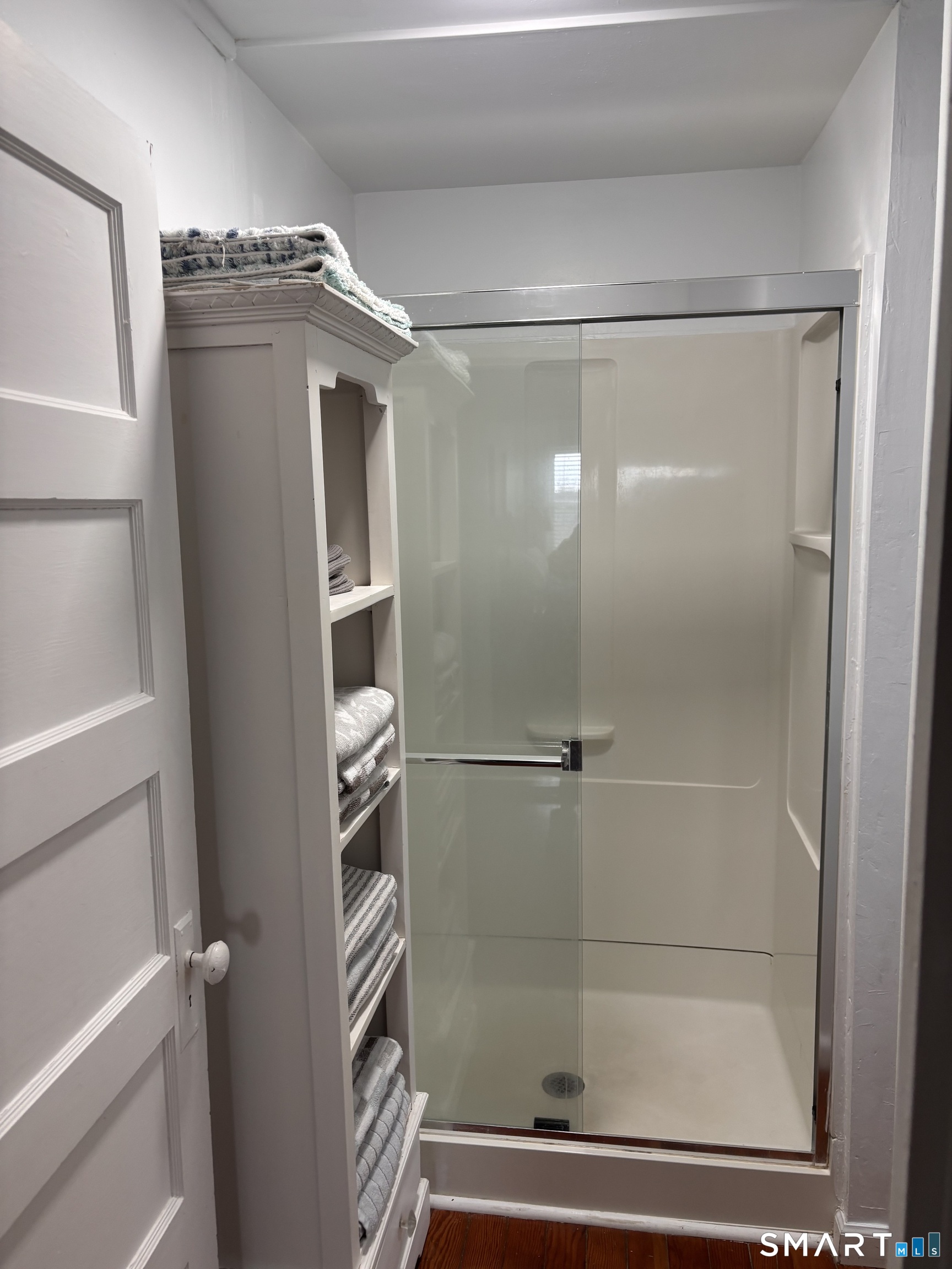 11 Uncas Road East Lyme, CT 06357 - Photo 26 of 28 a bathroom with a glass shower door