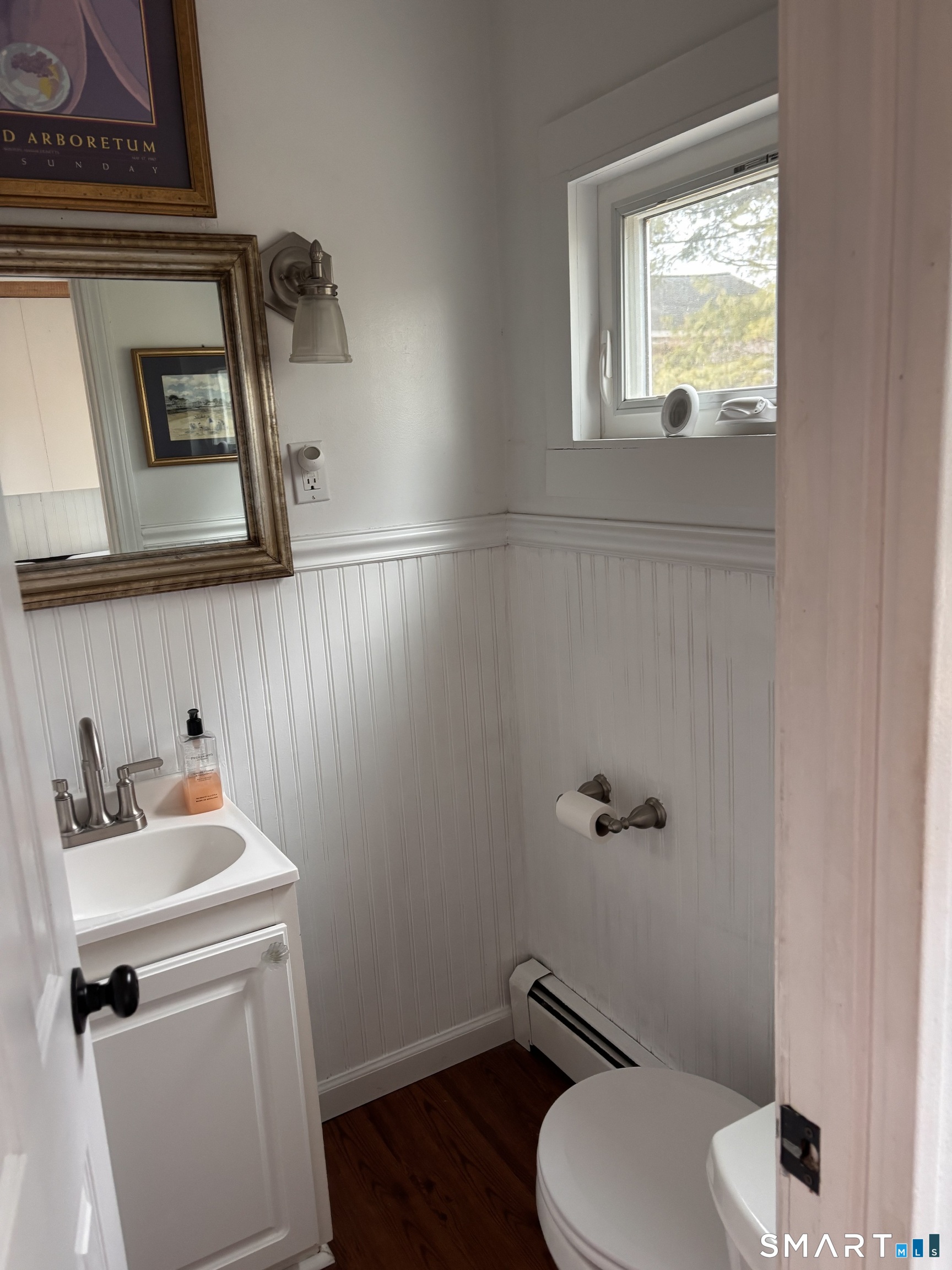 11 Uncas Road East Lyme, CT 06357 - Photo 27 of 28 a bathroom with a toilet sink and mirror