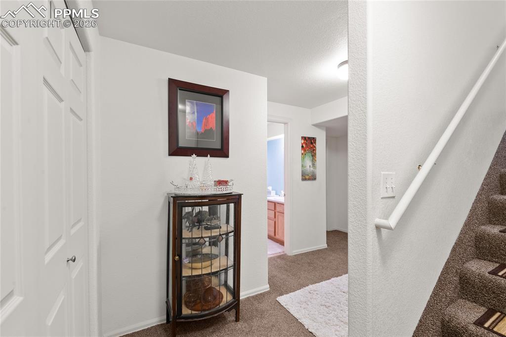 5639 Sunshade Point Colorado Springs, CO 80923 - Photo 29 of 36 a view of a hallway with workspace