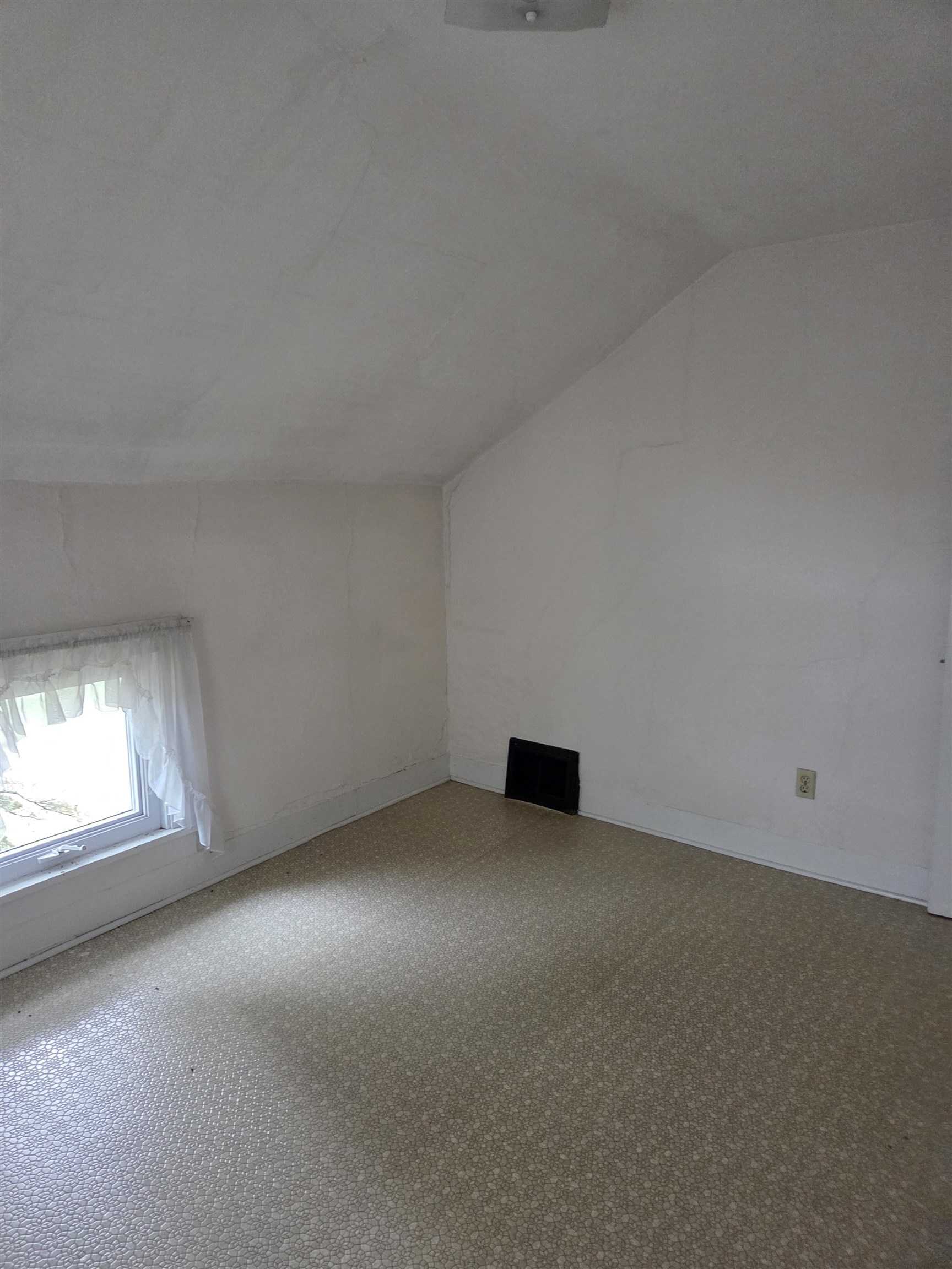 5910 North Unity Road Lena, IL 61048 - Photo 17 of 34 an empty room with a fireplace and windows