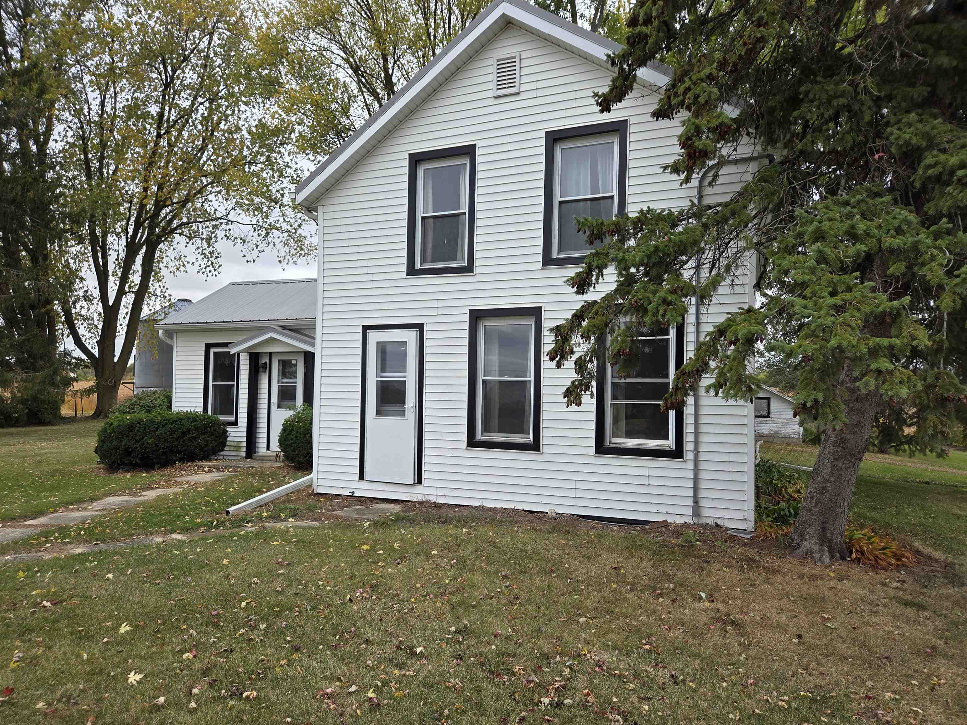 5910 North Unity Road Lena, IL 61048 - Photo 2 of 34 a front view of a house with a yard and garage