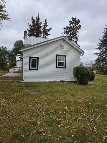 a backyard of a house with lots of green space