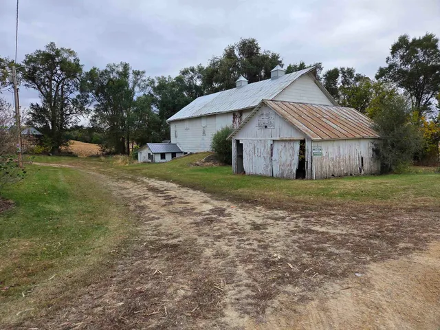 a view of a house with a yard and plants