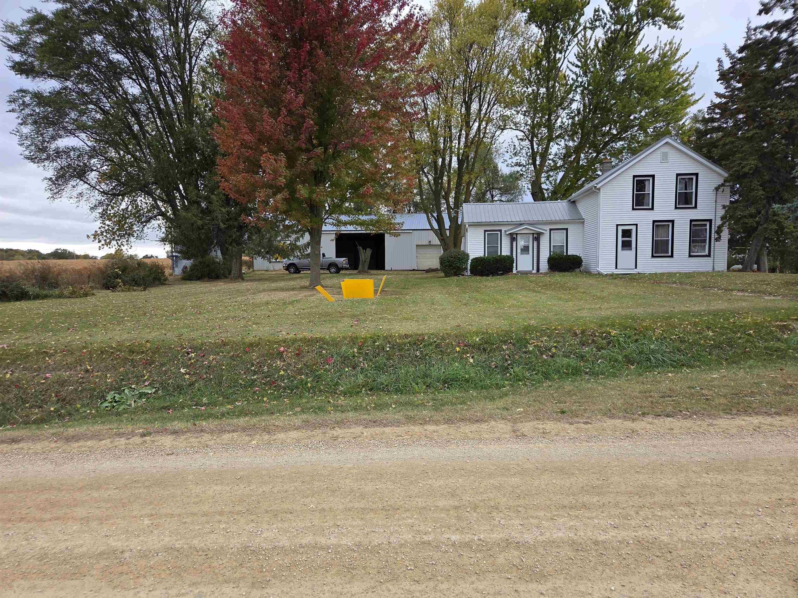 5910 North Unity Road Lena, IL 61048 - Photo 34 of 34 a front view of a house with a yard and trees