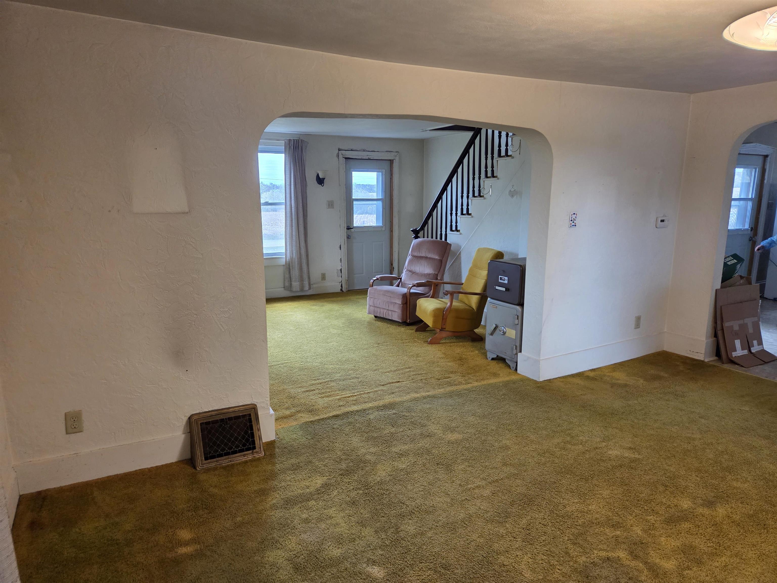 5910 North Unity Road Lena, IL 61048 - Photo 8 of 34 a view of a livingroom with a staircase