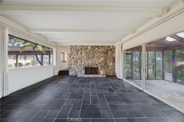 a view of empty room with windows