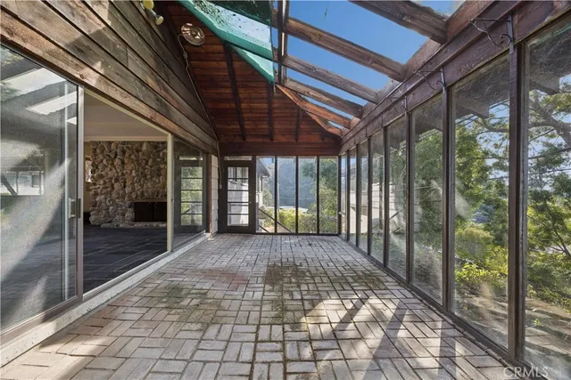 a view of a porch with a floor to ceiling window