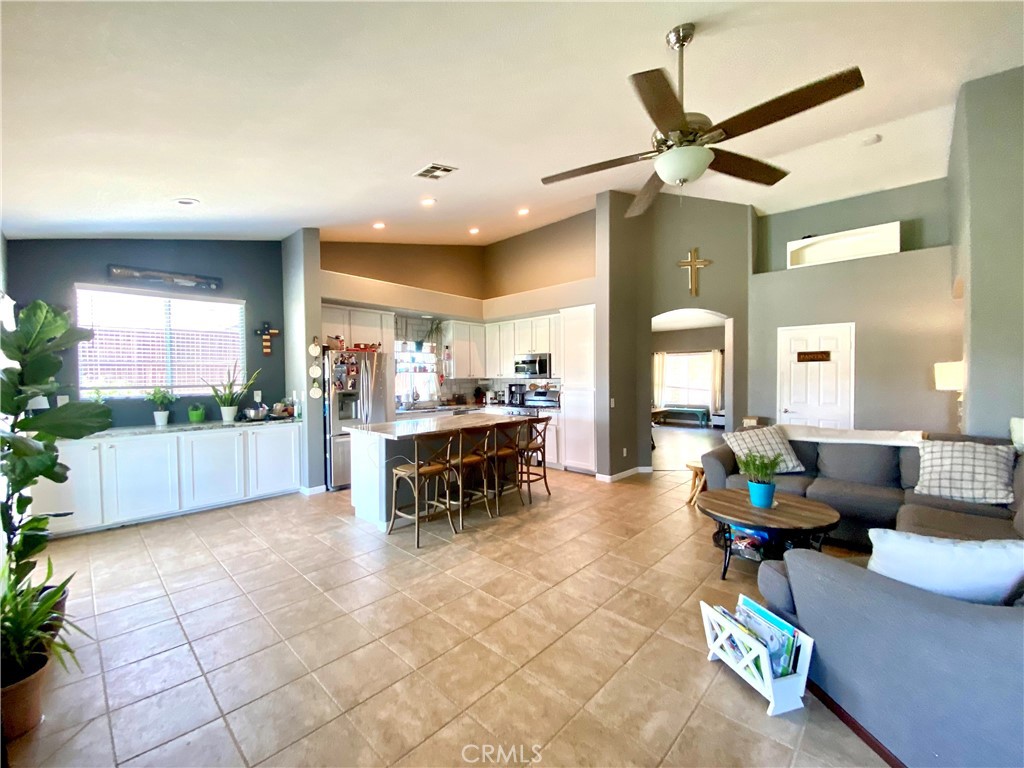 36768 Pomerol Loop Winchester, CA 92596 - Photo 12 of 31 a living room with furniture and a large window