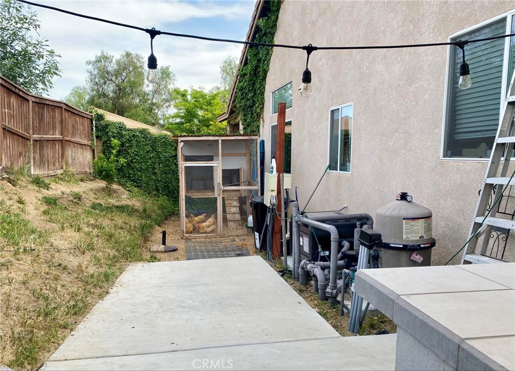 36768 Pomerol Loop Winchester, CA 92596 - Photo 30 of 31 a front view of a house with a yard