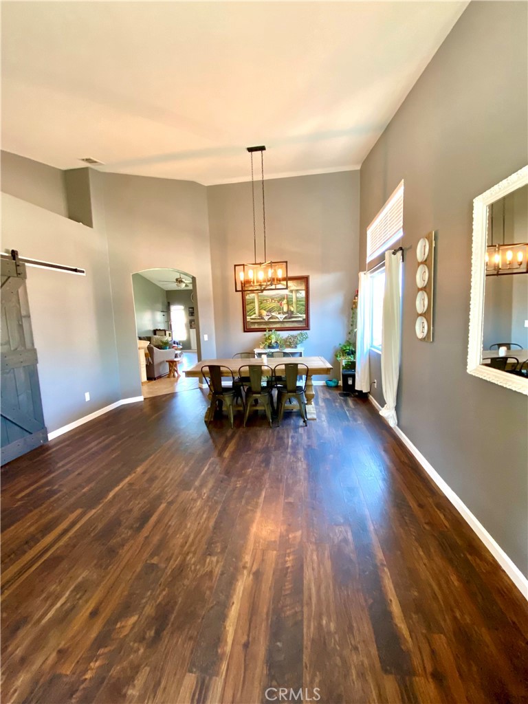 36768 Pomerol Loop Winchester, CA 92596 - Photo 4 of 31 a living room with furniture and a wooden floor