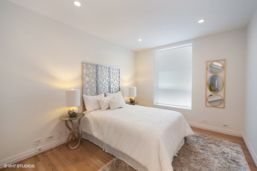 1011 North Dearborn Street Chicago, IL 60610 - Photo 24 of 33 a bedroom with a bed and a window