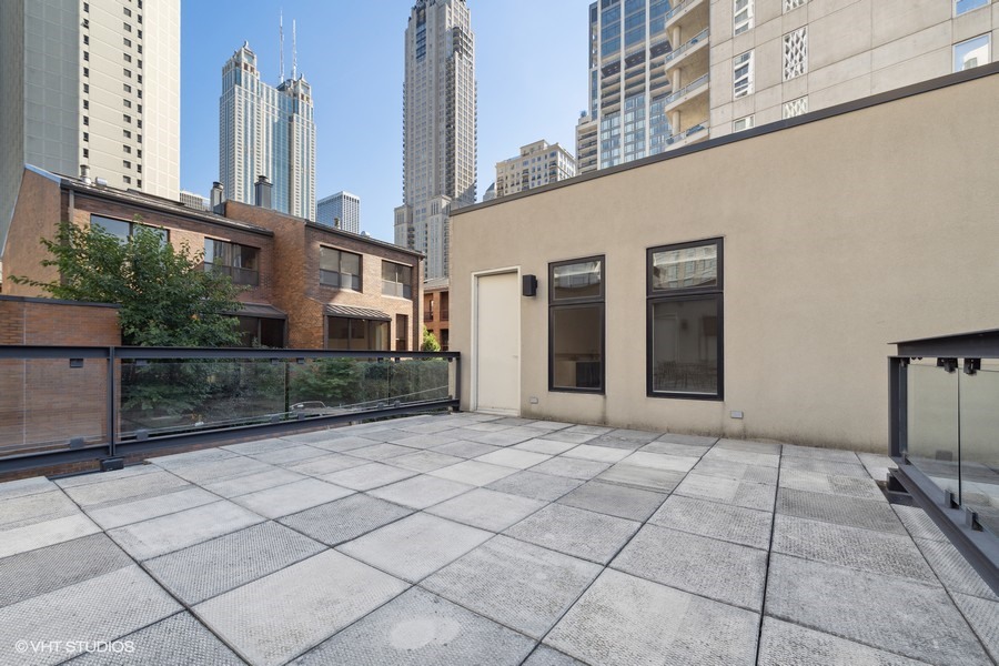 1011 North Dearborn Street Chicago, IL 60610 - Photo 29 of 33 a view of a building with a bench and entryway
