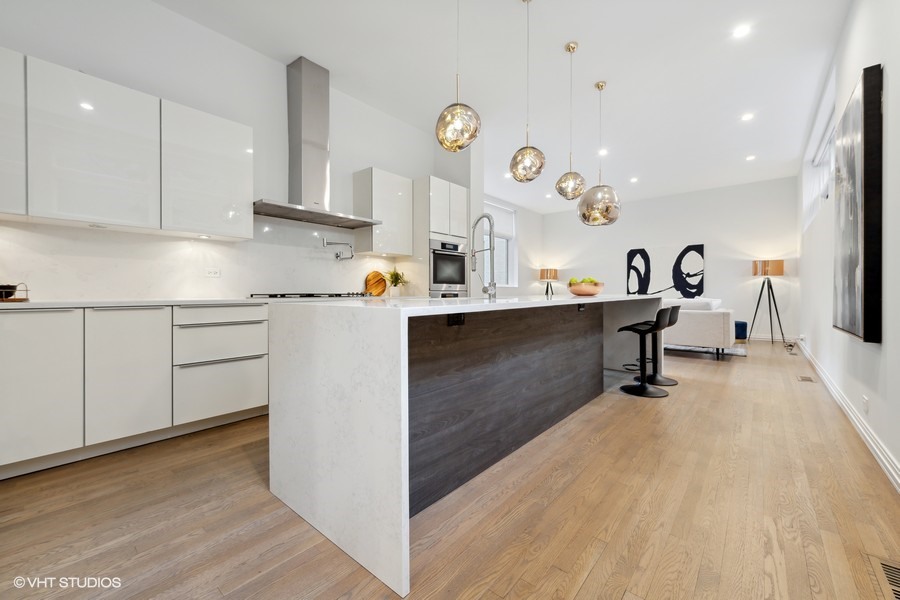 1011 North Dearborn Street Chicago, IL 60610 - Photo 10 of 33 a living room with stainless steel appliances granite countertop furniture wooden floor and a view of kitchen
