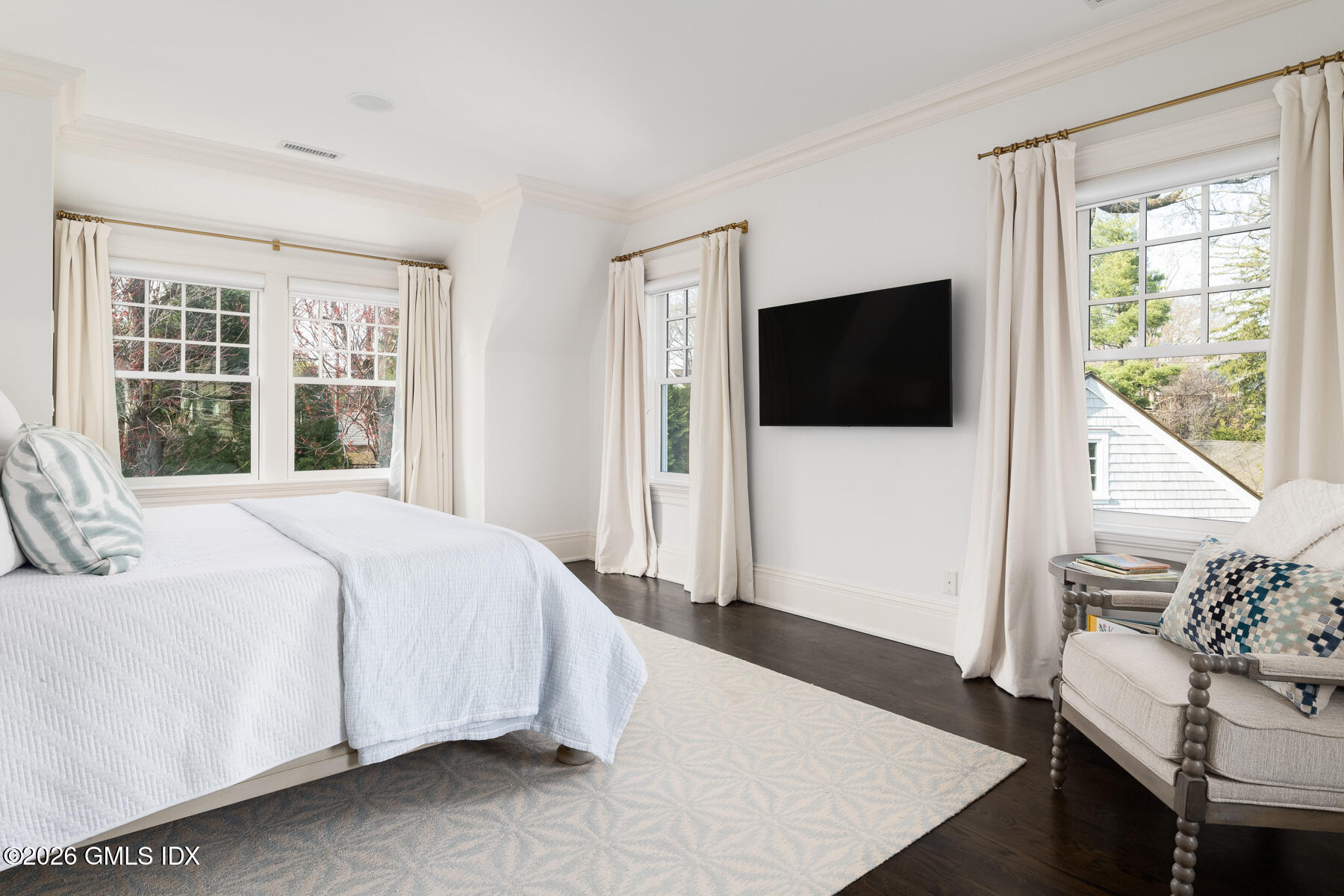 45 Willow Road Riverside, CT 06878 - Photo 17 of 35 a bedroom with a bed and a flat screen tv