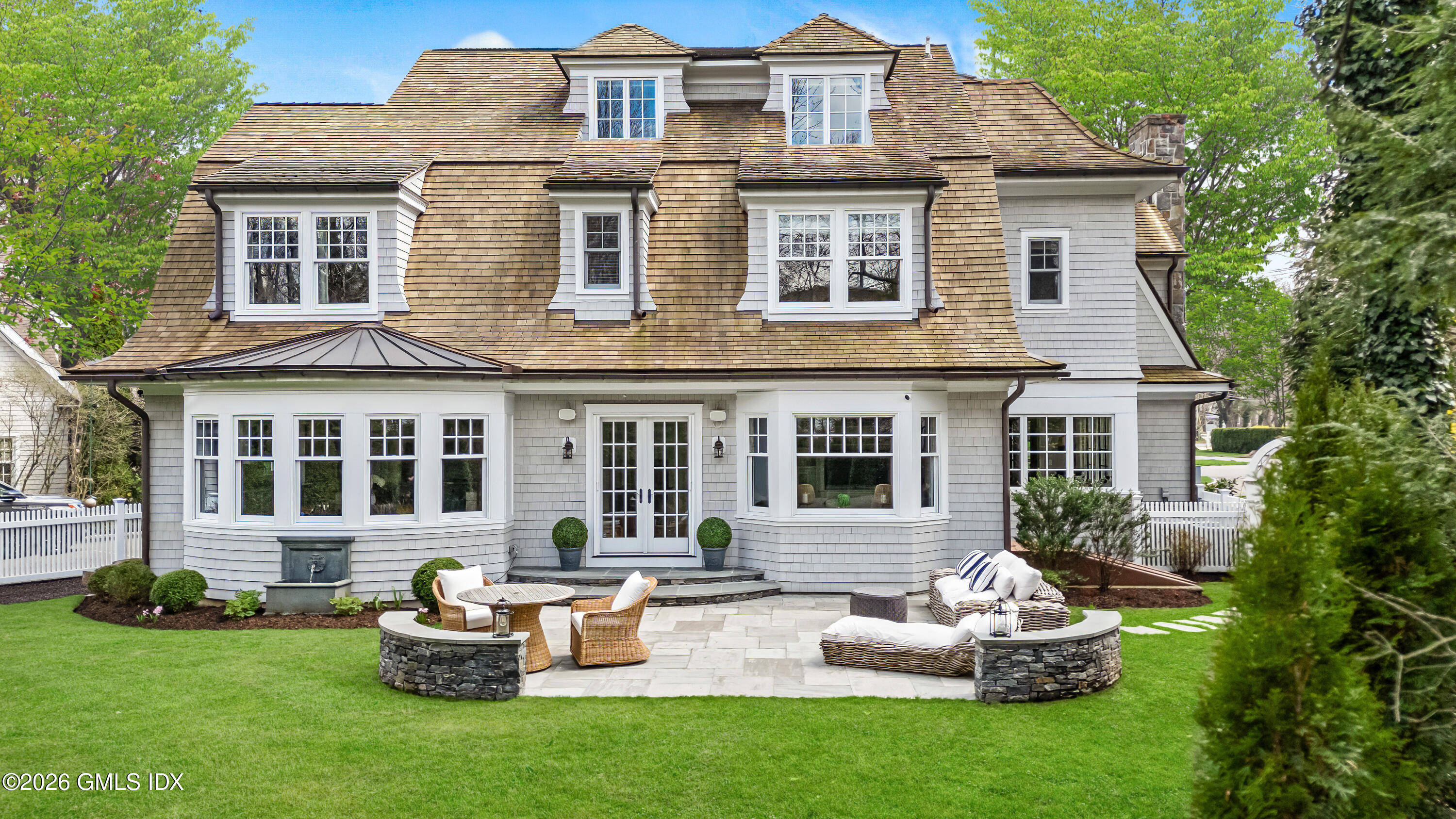45 Willow Road Riverside, CT 06878 - Photo 2 of 35 a front view of a house with a garden and patio