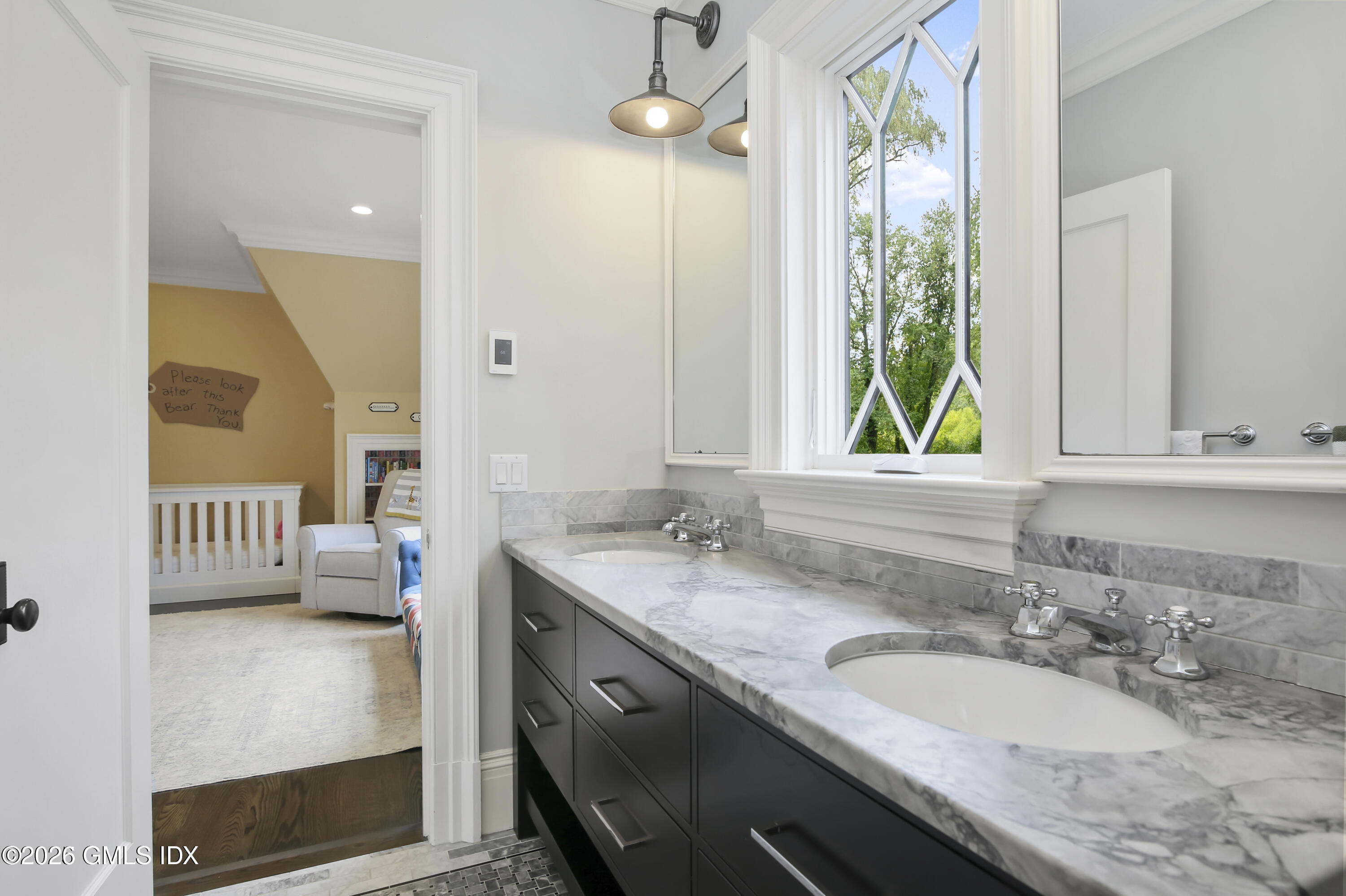 45 Willow Road Riverside, CT 06878 - Photo 22 of 35 a en suite bathroom with a granite countertop sink and a mirror