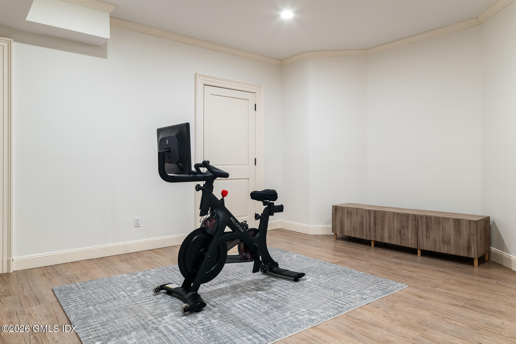 45 Willow Road Riverside, CT 06878 - Photo 25 of 35 a room with gym equipment and wooden floor