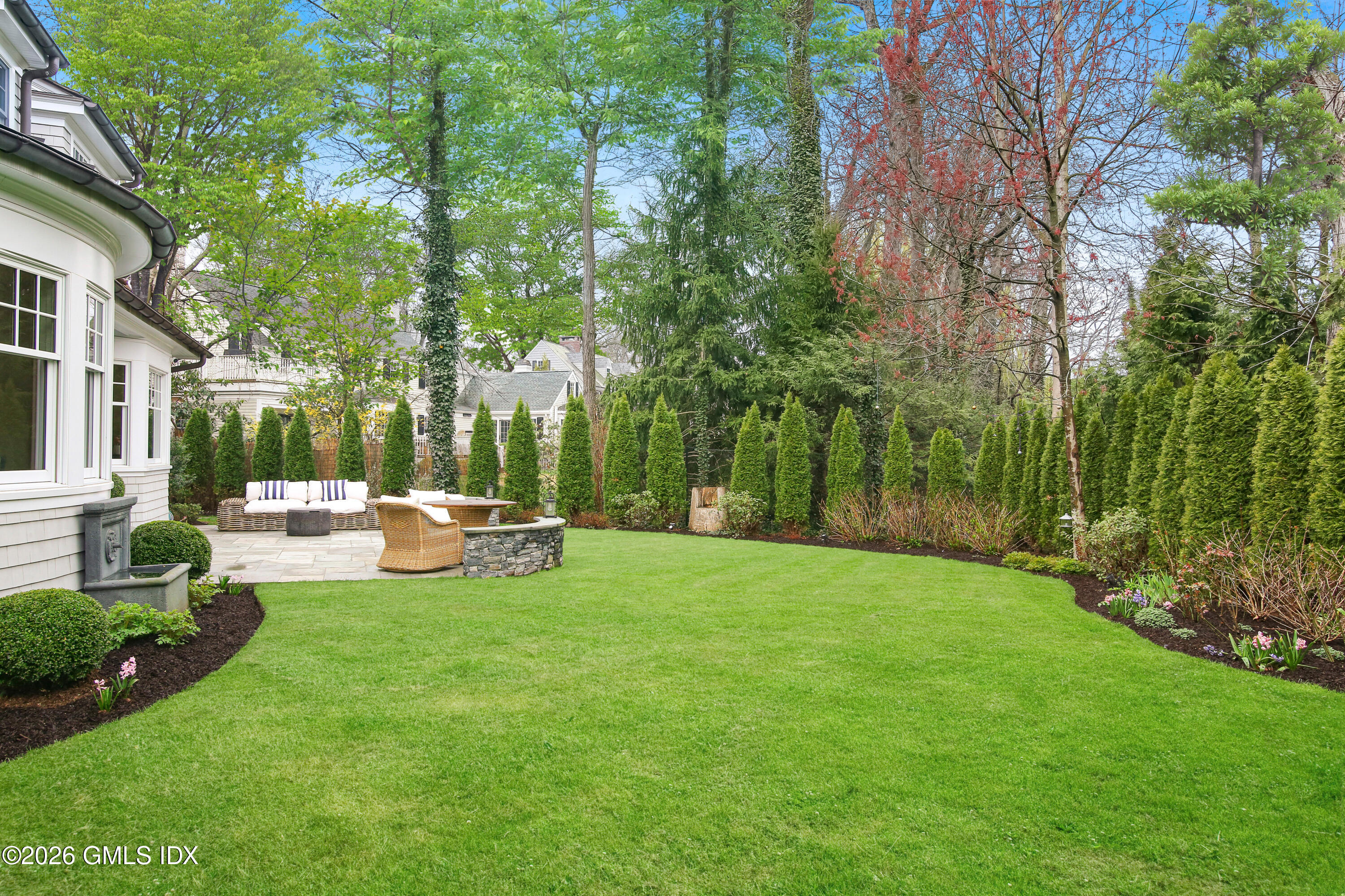 45 Willow Road Riverside, CT 06878 - Photo 3 of 35 a view of backyard with a sitting area and garden