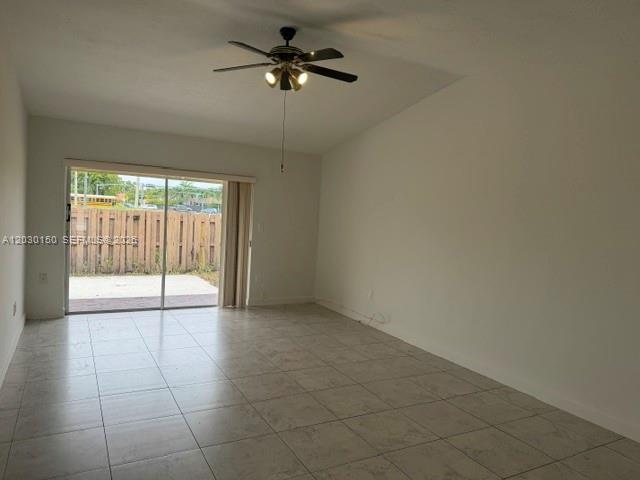 11206 Southwest 125th Place, Unit 11206 Miami, FL 33186 - Photo 4 of 15 a view of an empty room with a window