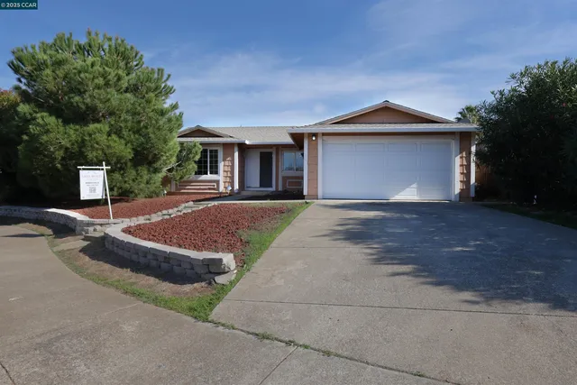 a front view of a house with yard