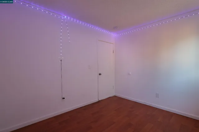 a bed room with furniture and a flat screen tv