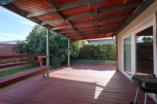 a backyard of a house with yard and outdoor seating
