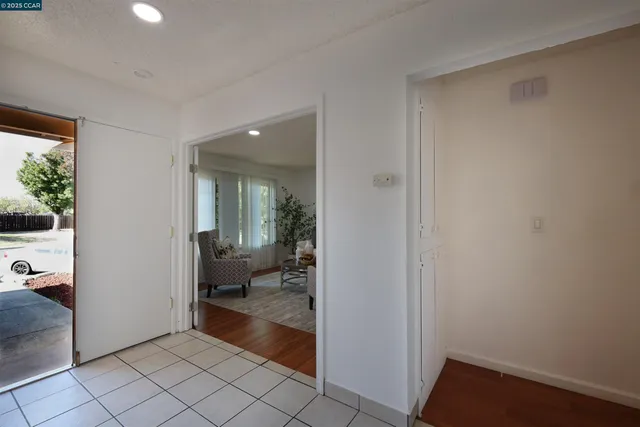 a view of a hallway with bathroom