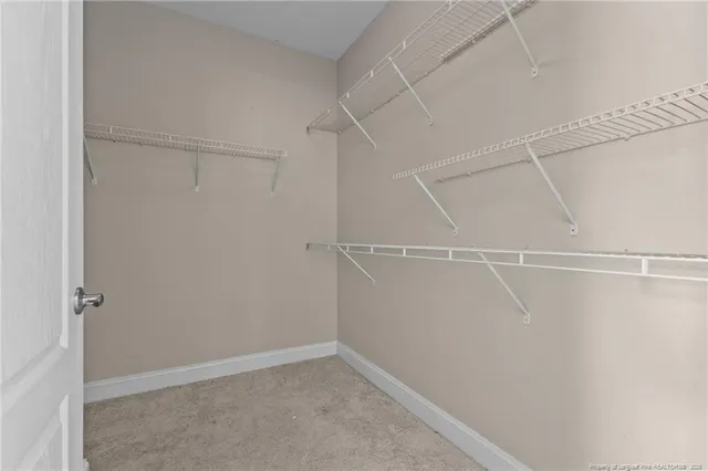 a view of an empty walk in closet