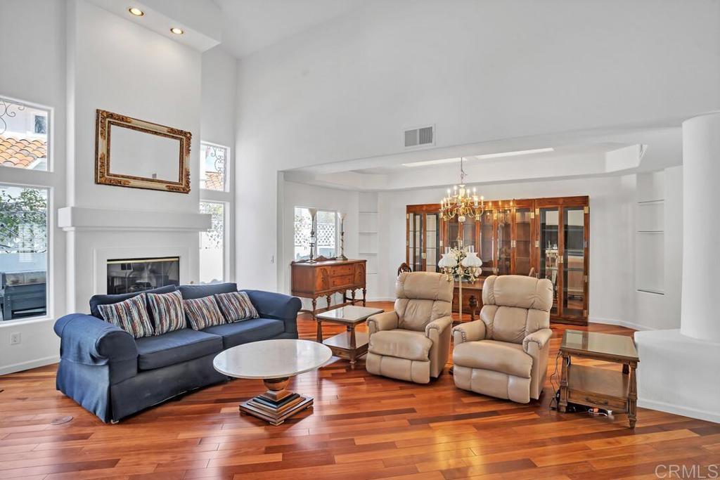 4617 Cyrus Way Oceanside, CA 92056 - Photo 19 of 63 a living room with furniture fireplace and a large window