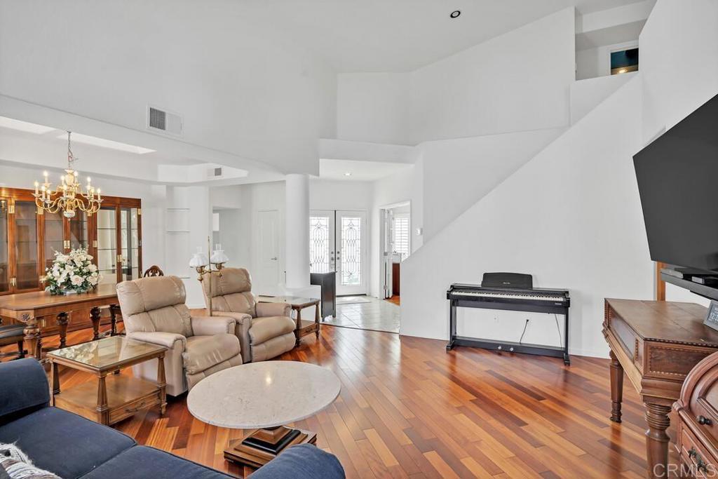 4617 Cyrus Way Oceanside, CA 92056 - Photo 20 of 63 a living room with furniture a rug and a flat screen tv