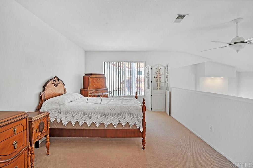 4617 Cyrus Way Oceanside, CA 92056 - Photo 22 of 63 a bedroom with a bed and window