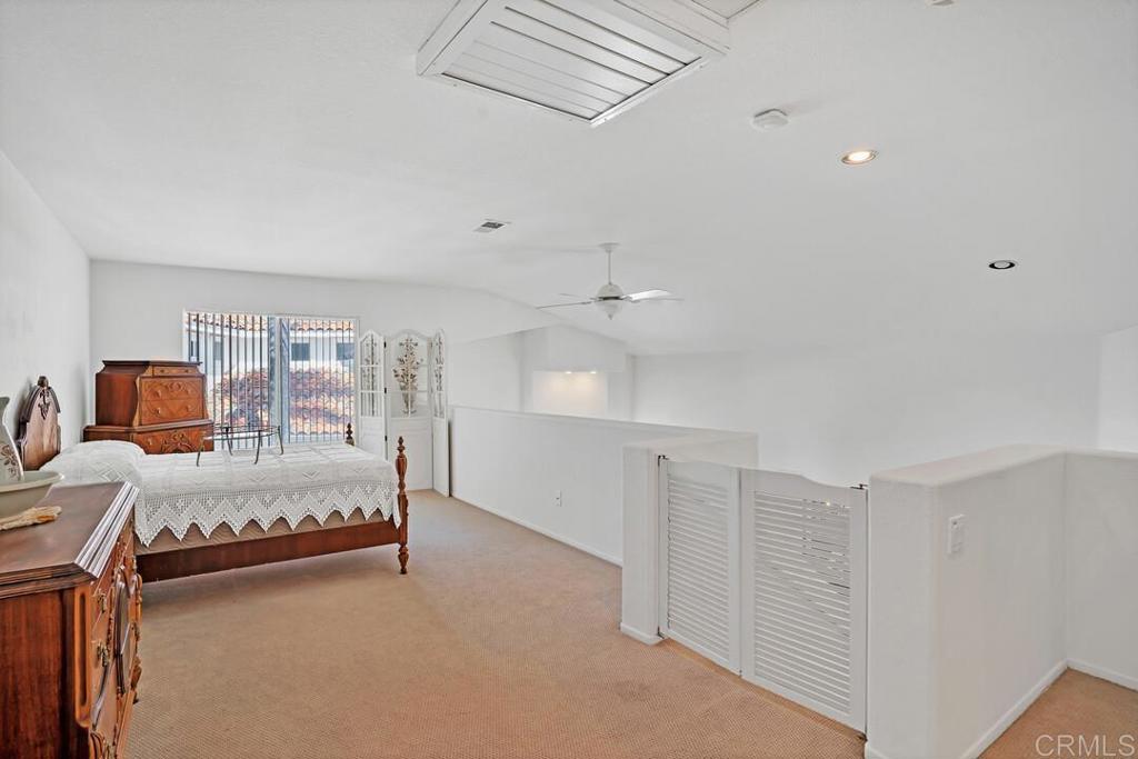 4617 Cyrus Way Oceanside, CA 92056 - Photo 26 of 63 a spacious bedroom with a bed and window