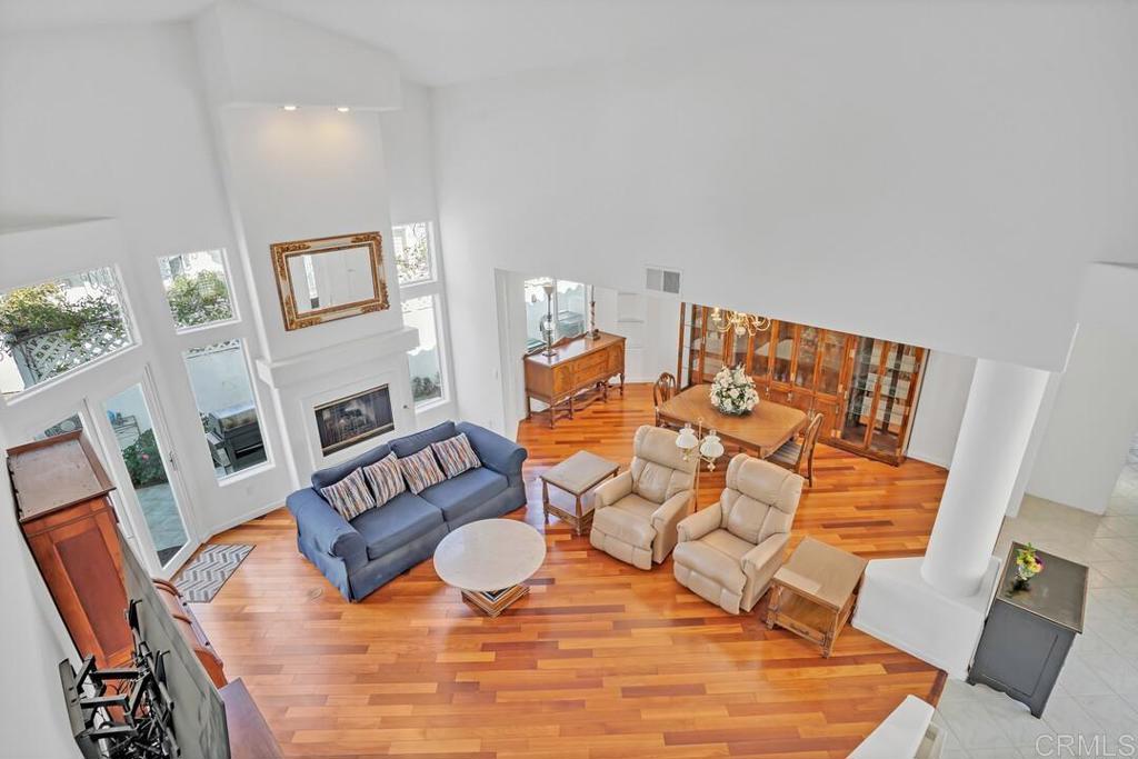 4617 Cyrus Way Oceanside, CA 92056 - Photo 27 of 63 a living room with furniture and wooden floor