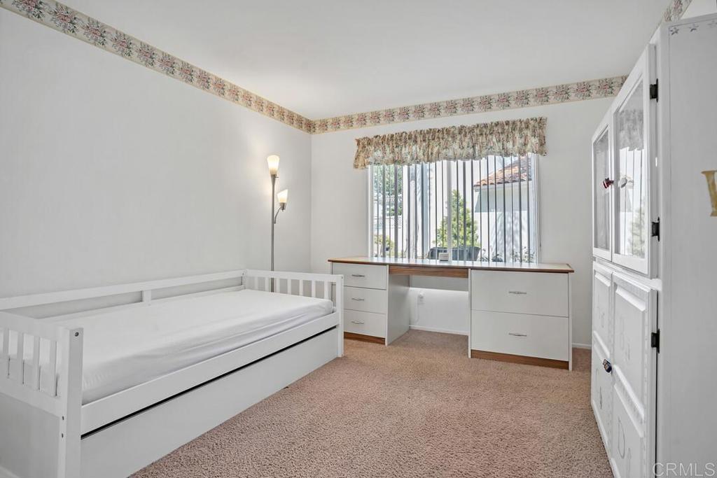 4617 Cyrus Way Oceanside, CA 92056 - Photo 28 of 63 a room with a bed and a large window